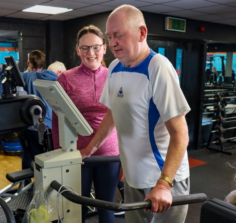 man in gym working with physio