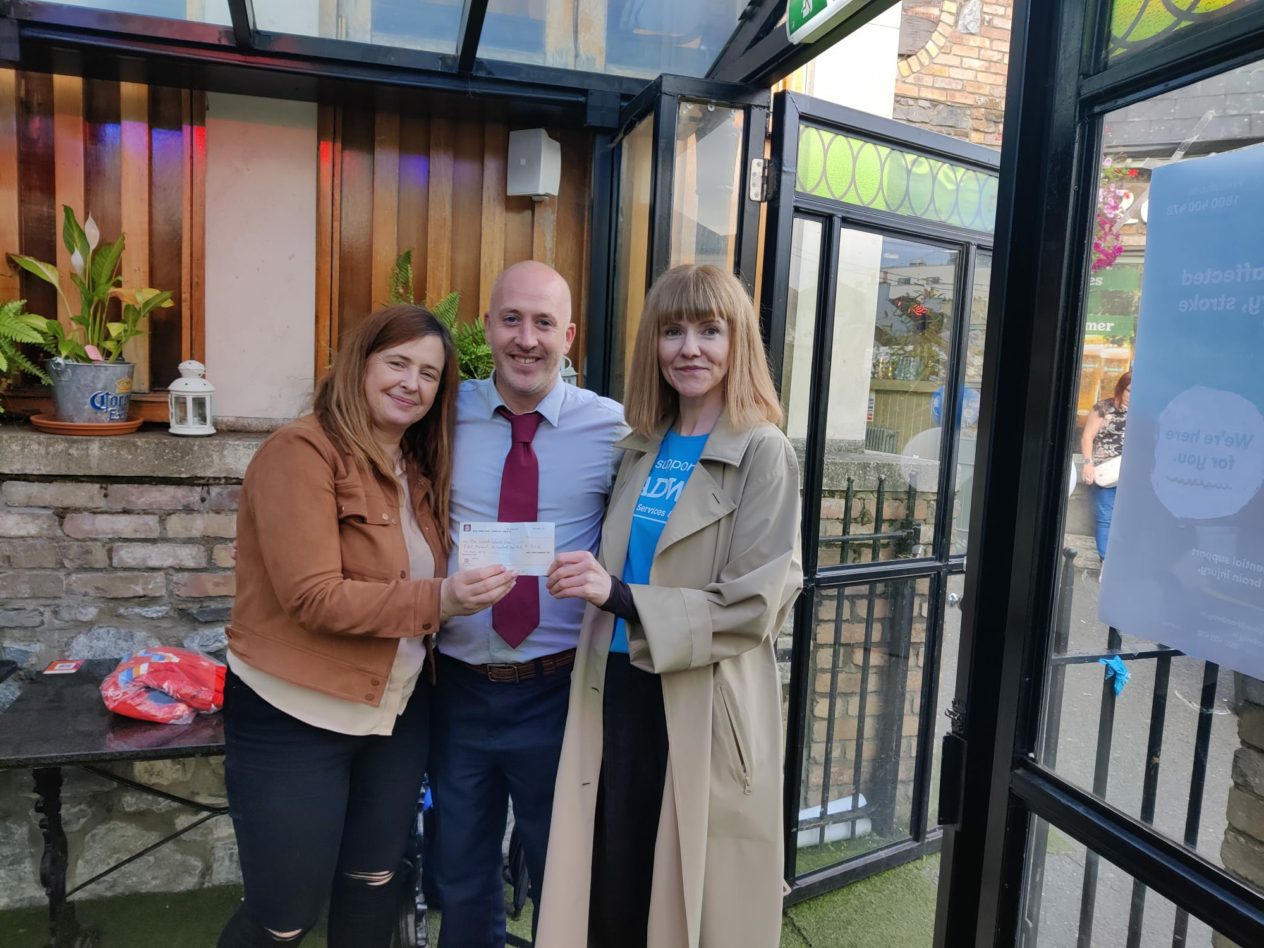 Fiona Murphy, Headway CEO and Louise and Donal from Penny Hill Pub presenting sponsorship cheque